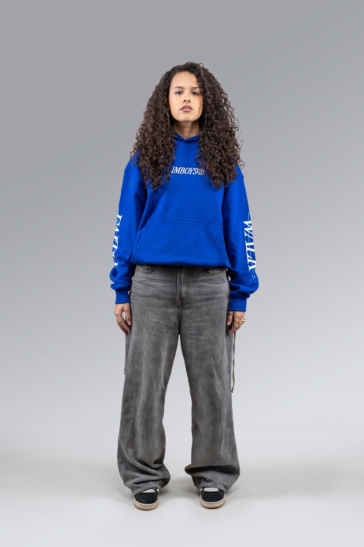 Female model wearing Blue Faith Walk Hoodie, front view