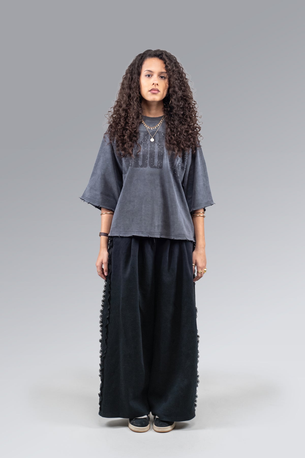Female model wearing Black Rhinestone Tee, front view