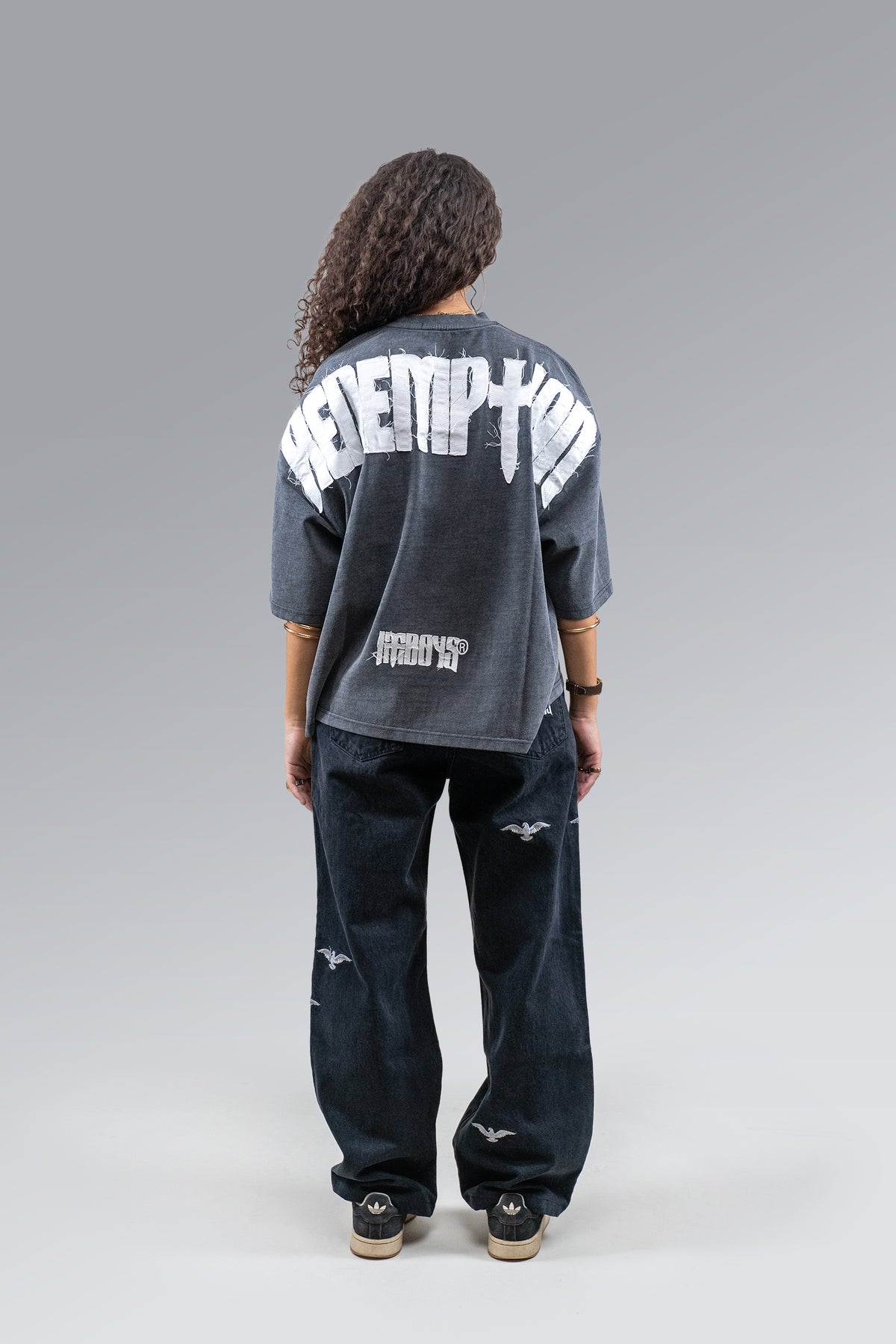 Female model wearing Patch Tee, back view