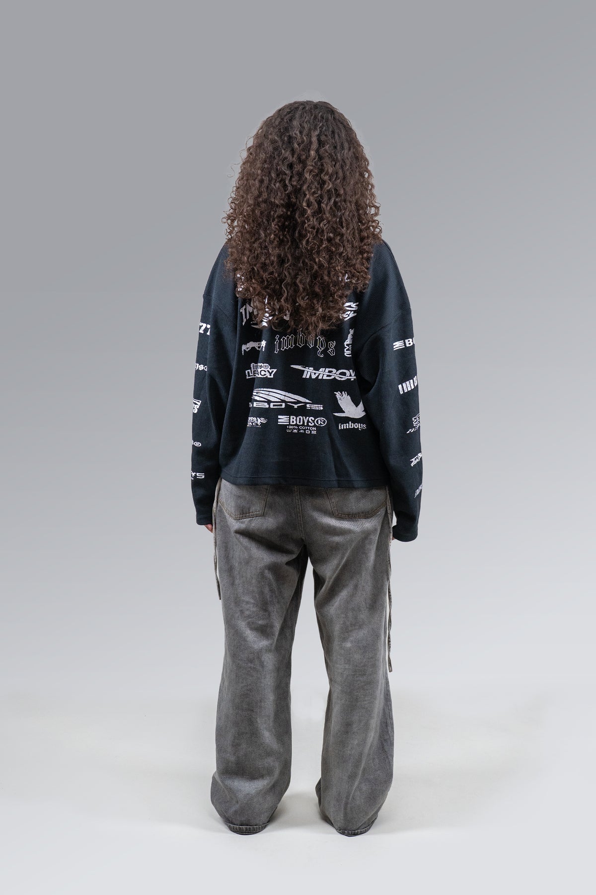 Female model wearing Legacy Logo Thermal, back view